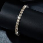 Tennis bracelet in sterling silver with pave set yellow zirconia.